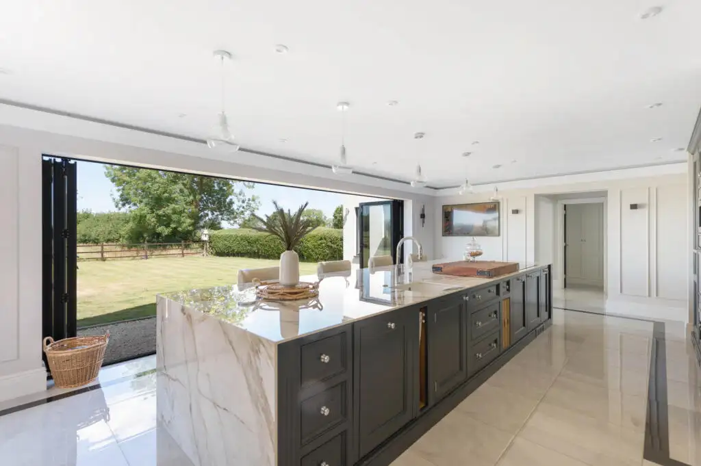 Open plan kitchen and island in the finished Graveley new build